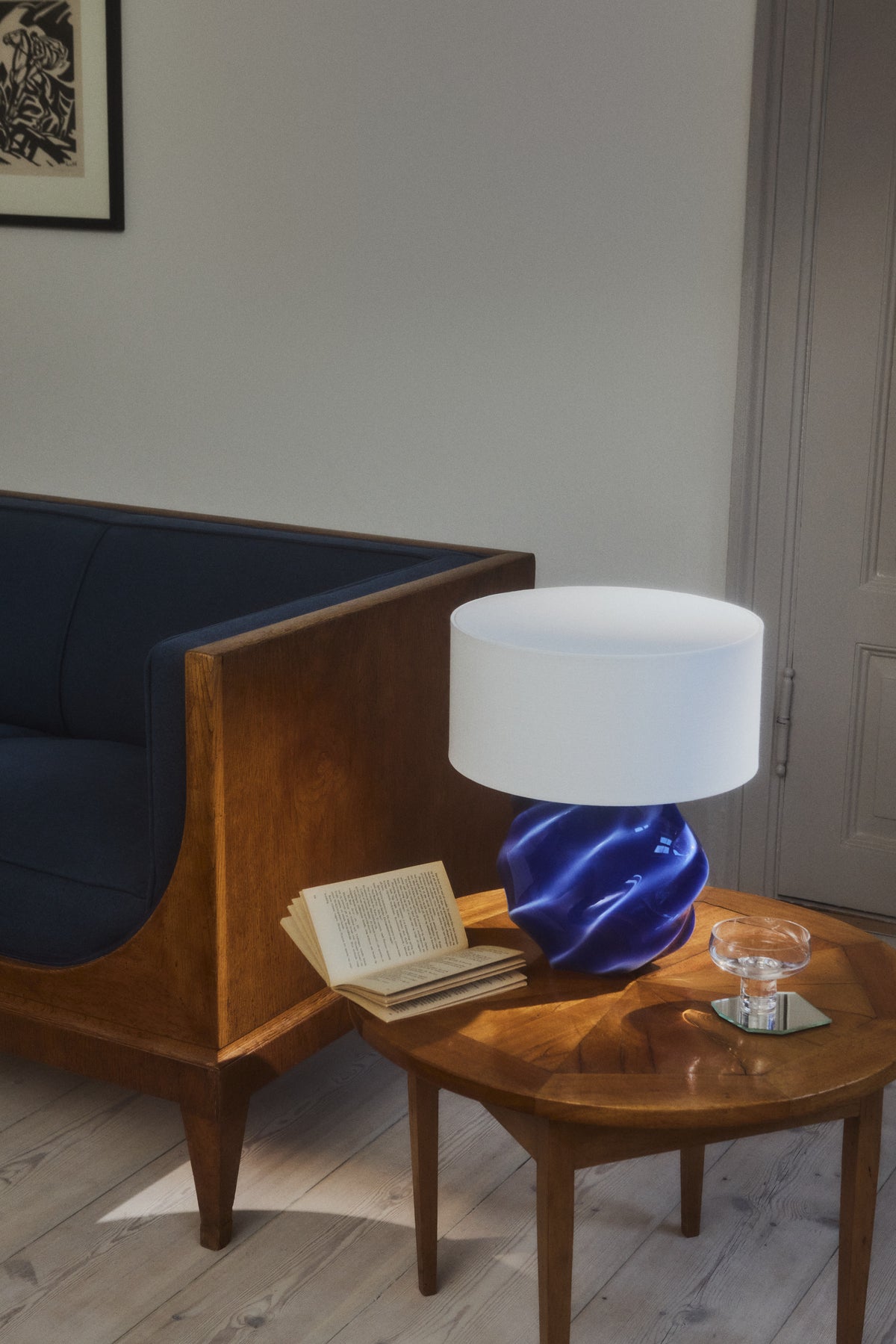 Kontur lamp on a side table with a book 