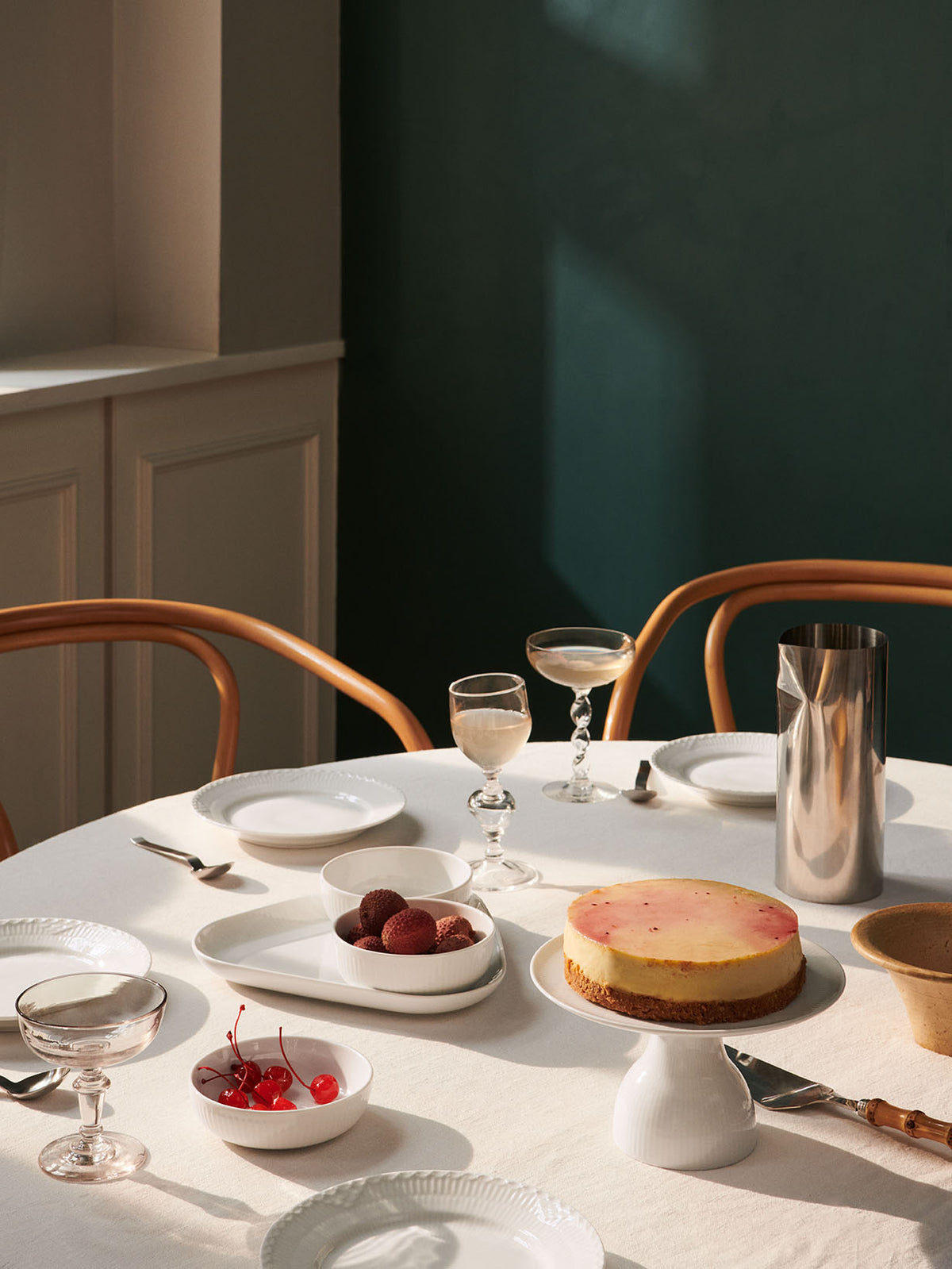 Dining table set with White Fluted Half Lace and White Fluted Porcelain from Royal Copenhagen.